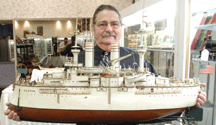 Noel Barrett with one of the top individual lots of the sale the Marklin steam battleship Boston which measured more than 40 inches in length The piece was purchased for 71500 by New York City dealer Stephen Weiss acting on behalf of a client