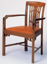 This mahogany ebony and oak upholstered armchair by Charles Sumner Greene and Henry Mather Greene came from the living room of the Robert R Blacker house in Pasadena Calif Made in 1907 by the Peter Hall Manufacturing Company it is part of the collection donated to LACMA by Max Palevsky