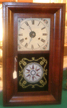 Hatfield House featured a Nineteenth Century American mantel clock with painted dial and reverse painting on glass depicting a compass