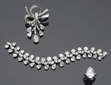 Harry Winston creations were popular Diamond and platinum bow brooch 29375 diamond and platinum bracelet 160250 and the auctions top lot a pearshaped 1166 carat diamond and platinum ring 402250