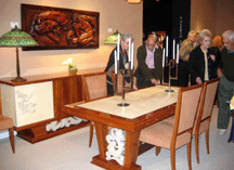 No one sells more at Palm Beach than Coral Gables Fla Art Deco dealer Vallerio who drew a crowd to examine this French dining table circa 1930 of palisander wood and goatskin top with 12 chairs priced 39000