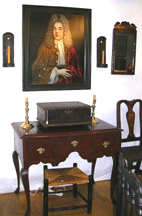 William Bakeman an antiques dealer from Massachusetts had an early lowboy as well as a European portrait of a nobleman on display in his booth