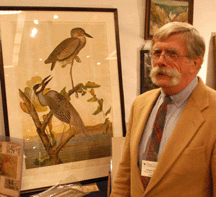 Dealer Dennis Willis with a rare second state Audubon print of a yellow crowned heron
