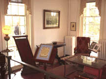 The west parlor in the main house featuring artifacts and artwork belonging to Thomas Cole