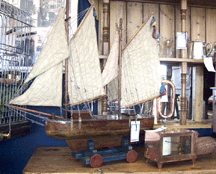 Susan Barr travels each year to England to bring back three containers of merchandise specializing in nautical antiques such as this childs pond boat