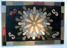 A charming hooked rug which according to one observer resembled the look of a splash into water