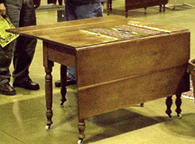 This Ohio gateway drop leaf table made from cherry circa 1860 was sold by Ron Eastman Mount Victory Ohio a regular at Scotts Antiques Market in Columbus The table opens to 68 inches and folds down to 24 by 48 inches