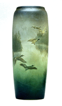 Kataro Shirayamadani designed the 1908 earthenware vase for Rookwood Pottery with a slippainted decoration of geese in flight beneath a distinctive matte vellum glaze