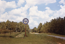 William Christenberry American born 1936 Pure Oil Sign in Landscape near Marion Alabama 1977 negative 1981 print dye transfer print 314 by 5 inches Philadelphia Museum of Art Purchased with the Alice Newton Osborn Fund 1982