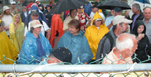 A thoroughly soaked crowd of anxious buyers waited in the rain for the opening of HeartOTheMart