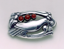 This silver bird brooch with cabochon cut coral circa 1925 and manufactured between 1933 and 1944 is pure Jensen Private collection