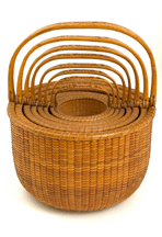 The nest of eight lightship baskets was made by Davis Hall on Nantucket in the latter part of the Nineteenth Century