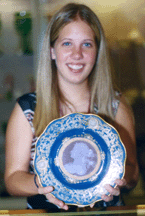 Gina Alderfer holding the patesurpate portrait Meissen plate that made a strong 8050 against the 8001000 teaser estimate