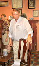 Hollis Brodrick in front of his trademark mantle