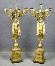 The pair of French Empire pair of gilt bronze candelabra each with eight lights realized 22000