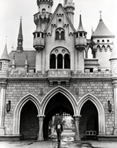 Walt Disney emerges from Sleeping Beauty Castle in Disneyland Anaheim Calif 1957