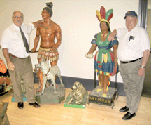 Ron Pook left with Bob Merritt president of Merritt Antiques and one of the principals of the sale with a few of the figures from the museum collection