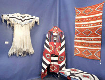 Native American artifacts including a Ute dress in the booth of David West Tucson Ariz