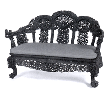 This Chinese Export carved wood sofa with carved cartouches of sea life and exotic birds on the back and arms went to a Hong Kong dealer for 25300