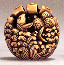 Eighteenth Century ivory netsuke by Okatomo in the form of a carp and waterwheel in curling waves 17250