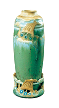 Syracuse NY potter Adelaide Alsop Robineau created Viking Ship Vase in 1905 Its stunning green and blue glazes form a sea to support the carved Viking ships