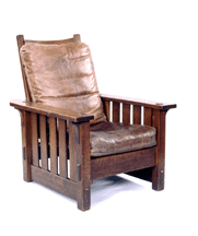 Gustav Stickley designed the armchair of oak and leather in 1901 for production at the Craftsman Workshops in Syracuse NY