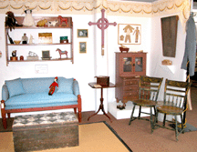Minutes after this photograph of Jane F Wargos booth was taken during the Okemo Antiques Show preview the early Nineteenth Century painted peg rack from New Paltz NY was sold The Wallingford Conn dealer had to find another means to display her vintage textiles