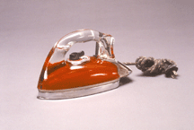 Silver Streak Iron circa 1946 manufactured by Saunders Corporation Pyrex glass metal cloth and plastic Courtesy of the Brooklyn Museum of Art