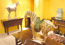 A rare Sanci glazed Tang dynasty horse in the booth of Alexander and Alexander Mira Loma Calif