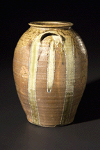 An unknown Catawba Valley maker created the fivegallon jar with fairly symmetrical runs Where the glaze is thin the color is purple where it is thicker green prevails