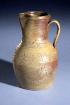 Chester Webster made the pitcher when he was 81 It is spare but incised fancifully with a bird on one side and a fish on the other and the date 1879 Collection of the Museum of Early Southern Decorative Arts