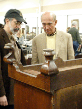 We are going to start displaying our furniture upside down stated Nadeau Previewers Bill Bartley and Peter Tillou examined the bottom of a New England cherry Queen Anne chest on frame that sold for 8050