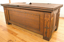 The rare blanket chest with carved panels designed by Zulma Steele sold to a buyer in the room for 57500