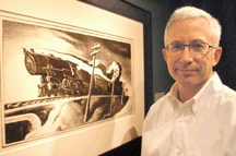 Joseph Gaddo of Hirschl amp Adler Galleries New York City with the bold Thomas Hart Benton image Going WestExpress Train The piece was among numerous sales reported by the gallery