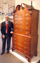 Yardley Penn dealer Todd Pricket with his Massachusetts Chippendale cherry bonnettop chestonchest