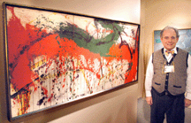 Patrick Albano of Aaron Galleries Chicago with Norman Bluhms untitled triptych