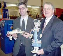 Sales coordinator Andrew Truman left and president Jim Julia holding two of the top sellers of the day the recordbreaking Gordon Bennet racer and an incredible Huret child doll