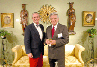 Enjoying the ambience of the show from the heights of the Bush Rooms center stage were at left John Lapinski vice president dealer relations at Antiques amp Fine Art Watertown Mass and Enrique Goytizolo owner of Georgian Manor Antiques Fairhaven Mass
