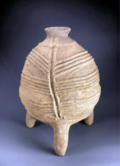 A large threelegged terra cotta container made by a potter of the Bura in Niger between the Third and the Eleventh Century exhibits careful shaping and decoration that implies that it was of special importance It and similar other examples from that area were usually found buried upside down Terra cotta 21 by 16 inches