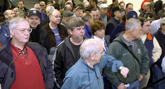 People hover at the entrance of Papermania Plus Saturday morning at 10 am waiting for the gates to open