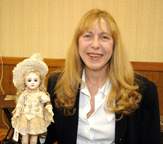 Joyce Kekatos a doll collector and seller from the Bronx NY stands with her prized purchase a 13inch Jumeau bb pictured in John Nobles book Beautiful Dolls Retaining not only its original wardrobe but also its original band on its left forearm the doll was acquired for 19800 Photo BritishAmerican Media Ltd