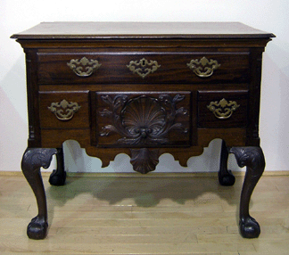 This Philadelphia Chippendale mahogany dressing table circa 1770 was the sales top lot at 81900 The lowboy featured a molded edge top with notched corners central drawer with carved shell and spandrels and cabriole legs with shell carved knees terminating in ball and claw feet