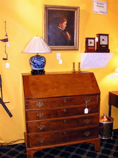 This circa 1770s Chippendale dropfront desk in figured cherry with secondary pine wood was offered by Windles Antiques
