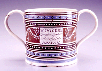 A unique doublehandled presentation mug made to commemorate the opening of William Rogers Boiler manufactory in Moorsfield Bristol in 1819 The piece is decorated with blue ochre and black banding