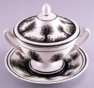 A faience fine mocha bouillon bowl with cover decorated in a black seaweed pattern against a white body impressed Creil circa 1810
