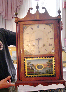 An Eli Terry pillar and scroll clock fetched 1265