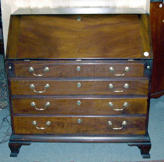 The Chippendale mahogany slant front desk by John Townsend of Newport RI attracted substantial presale interest and sold on the phone after a lively bidding spell for 82250 The desk retained the original Townsend label but not the feet