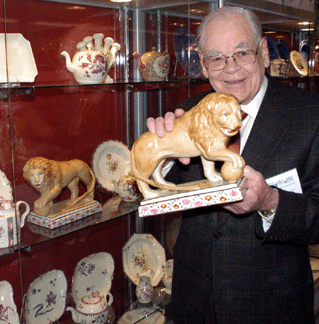 Peter Warren Wilton Conn with one of a pair of large Staffordshire lions with embroidery enameled bases