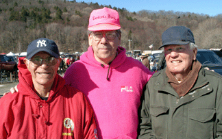 John Perry left and Joe Orzolek right have been regular exhibitors at the Elephants Trunk Flea market since it opened in 1975 They are shown here with show promoter Greg Baecker