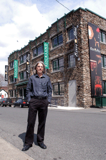 Manager Martin Greenstein in front of the architecturally impressive building